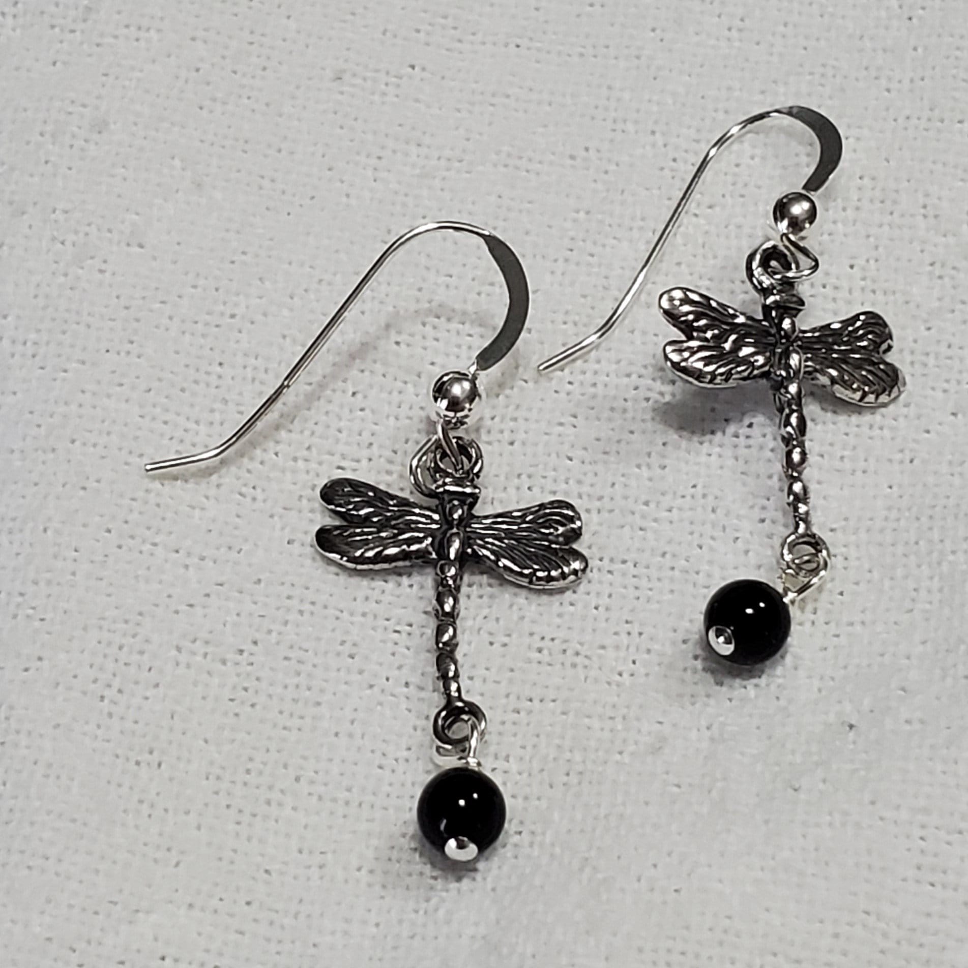 Delicate wire earrings. Incredible detail depicting dragonflies . Dragonflies symbolize poise and maturity. 